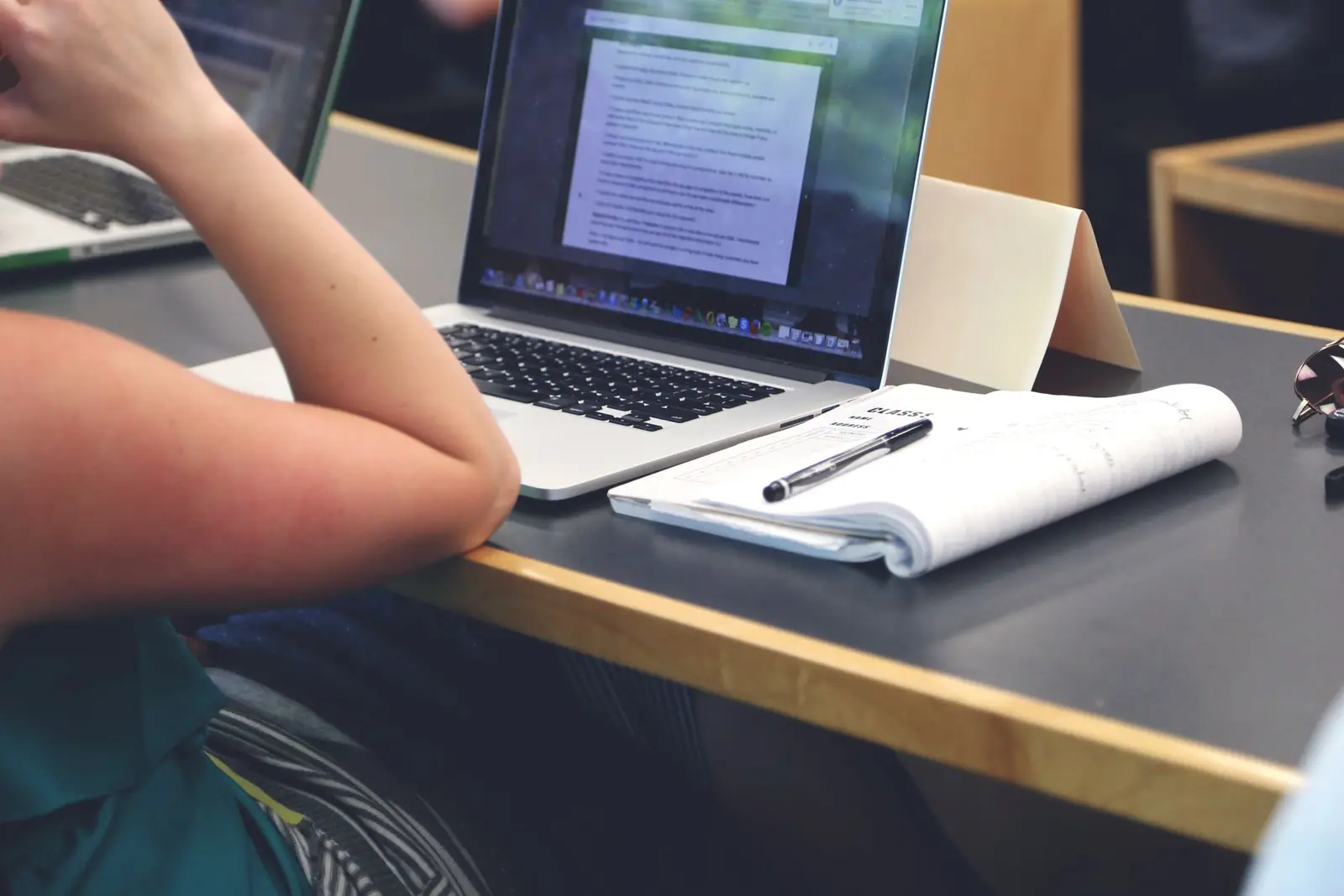 Students and teachers using laptops in a modern educational environment