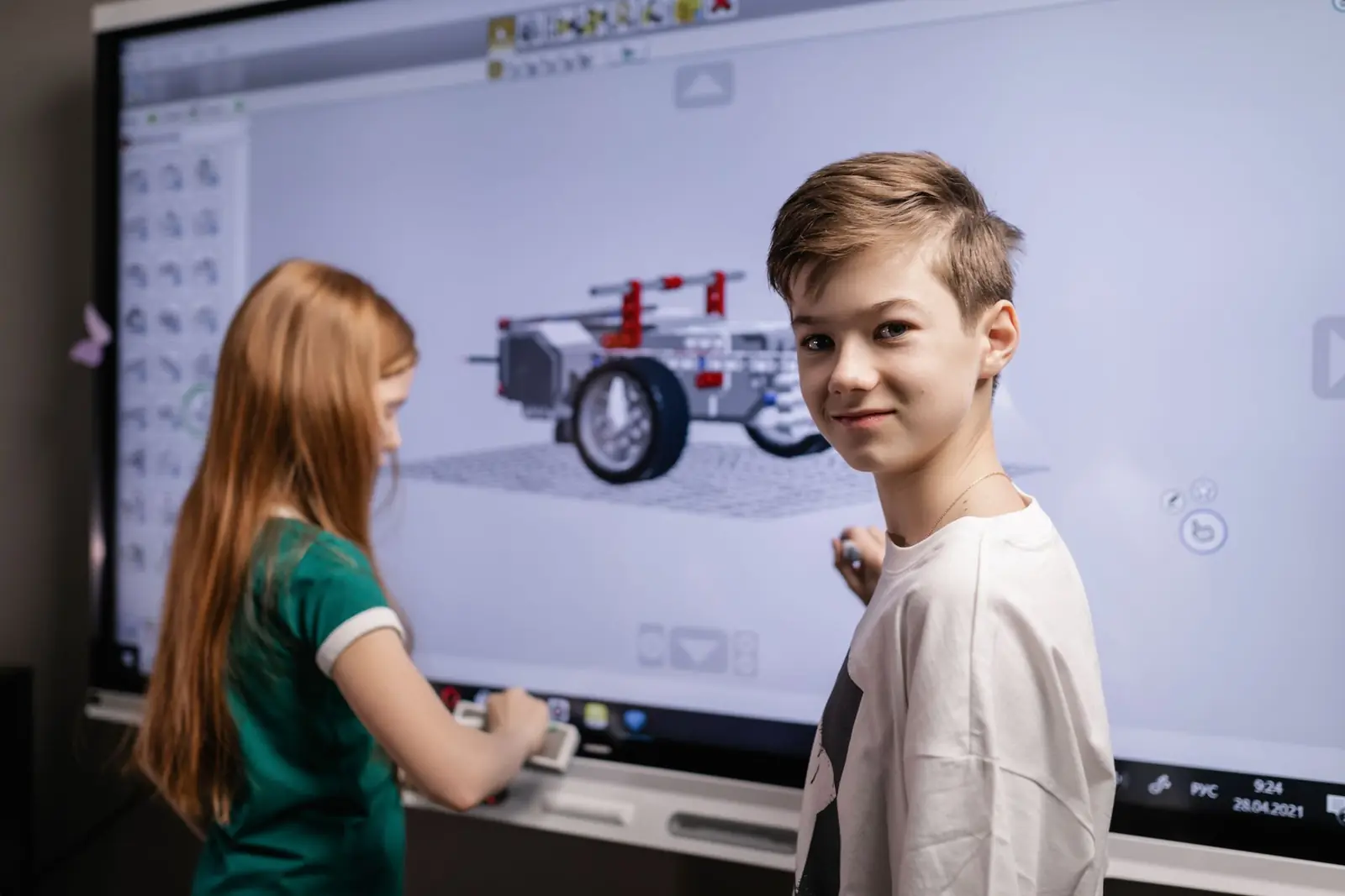 Teacher using an interactive display in a modern classroom